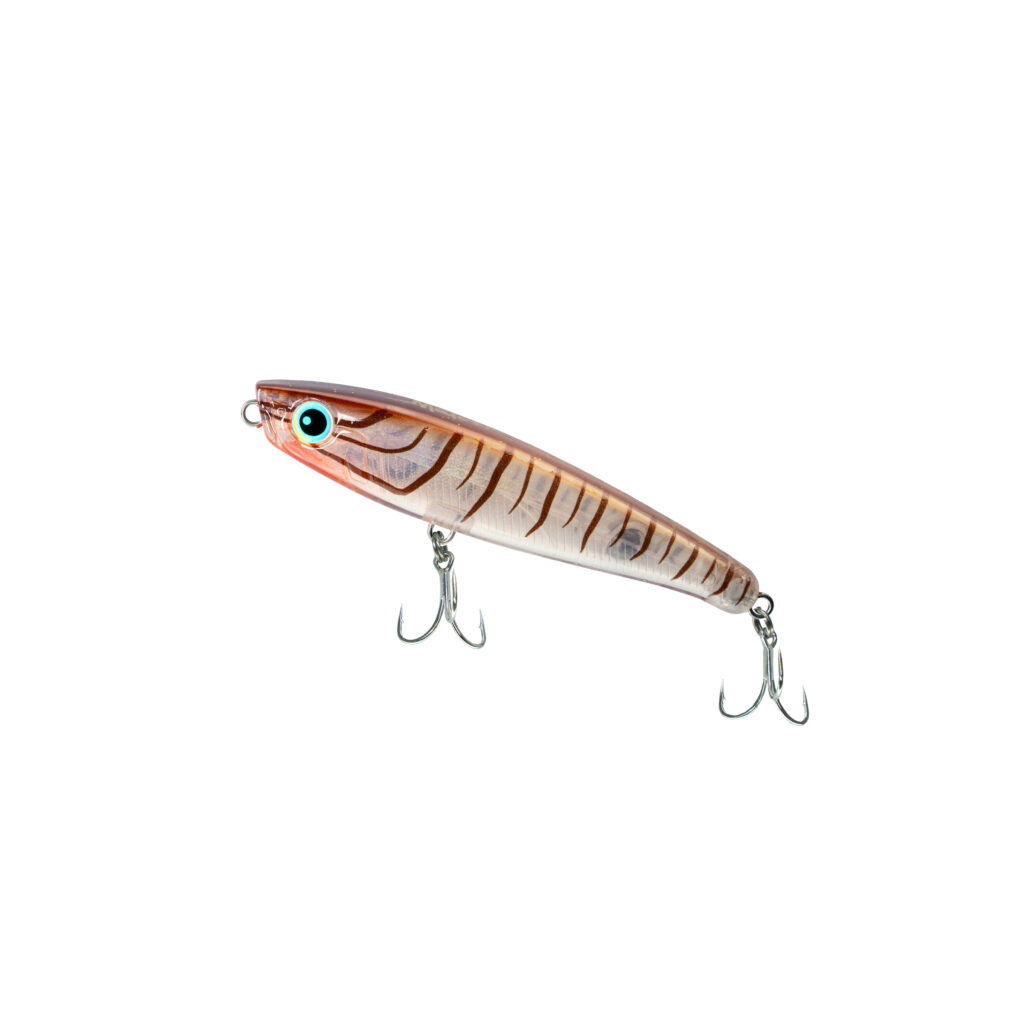 Close-up of an orange striped fishing lure with a turquoise eye and several sharp treble hooks visible below it.