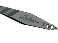 Metal fishing spoon lure with two treble hooks, engraved 'Malosi' and '100G' on a chrome blade, set against a black background.